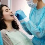 Dental professional using dream denistry during a dental checkup.