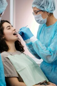 Dental professional using dream denistry during a dental checkup.